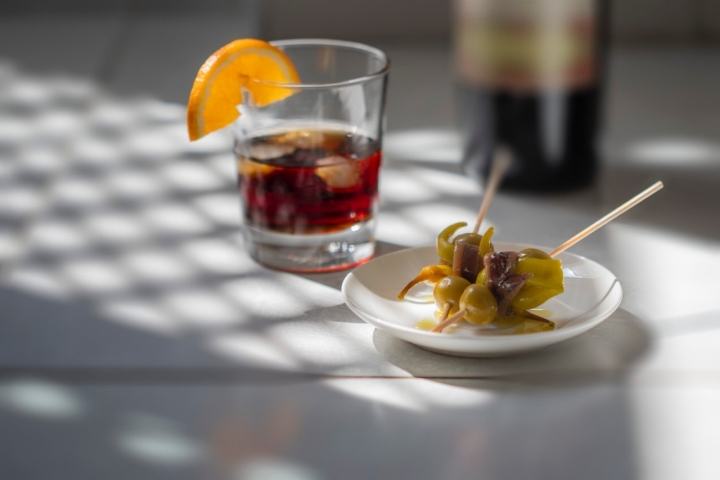 Traditional appetizers named 'Gilda' and a glass of vermouth in Spain